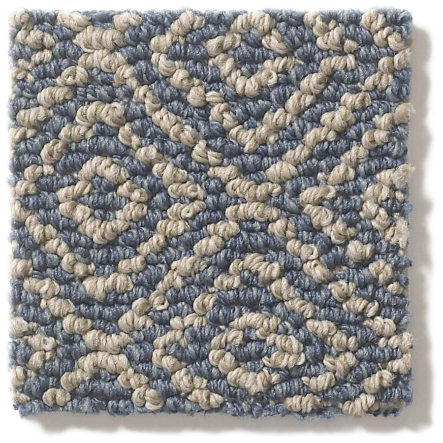 Stroll Pet Friendly Carpet swatch with a durable loop texture and a geometric diamond pattern in beige on a light blue background.