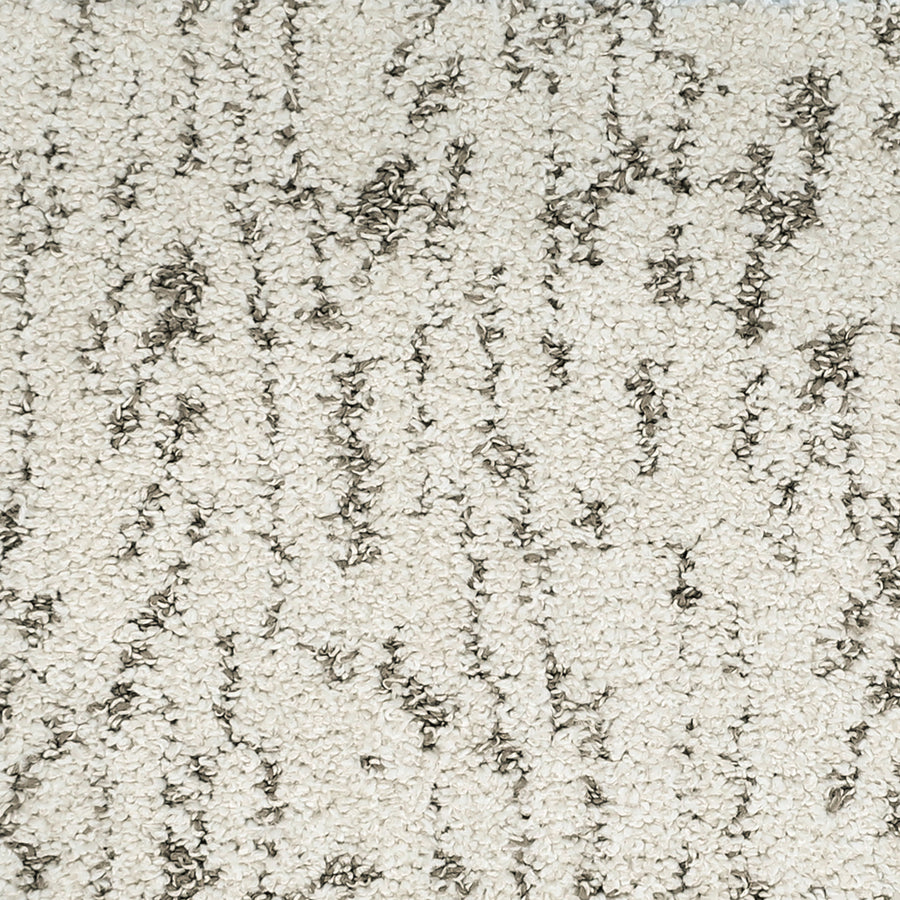 Close-up of Meow Mosaic Pet Friendly Carpet showing its textured surface, light beige background, and irregular wavy dark gray lines.