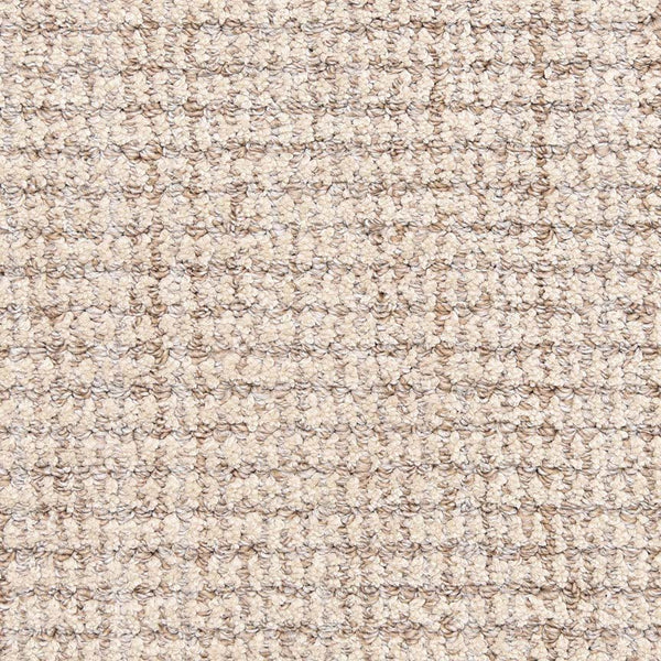 Close-up of Aspen Berber Carpet in Stone, featuring a tightly packed looped, woven texture. Its soft, uniform surface showcases the carpet’s durable construction and stylish berber design.