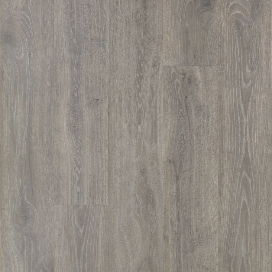 A close-up of Antique Style 9 7/16" Waterproof Laminate in Stone Hearth Oak shows grayish-brown planks with wood grain and natural knots, seamlessly arranged for an antique look.