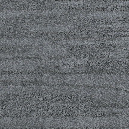 Close-up of Cirrus Berber Carpet in Storm, featuring a textured, mottled gray pattern and a soft, plush surface—ideal for anyone seeking premium flooring.