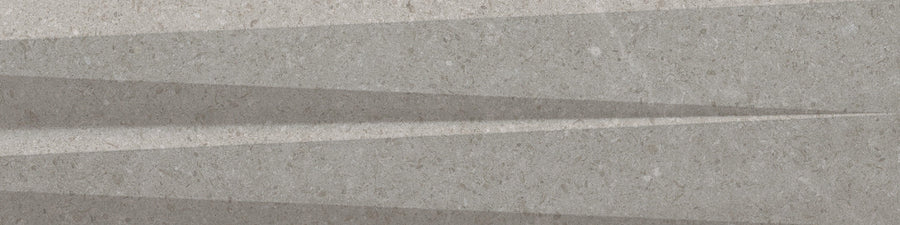 Sharp, triangular shadows cast across a textured gray surface create a geometric striped pattern reminiscent of Stripes 3" x 12" Transitional Ceramic Tile in Greige.