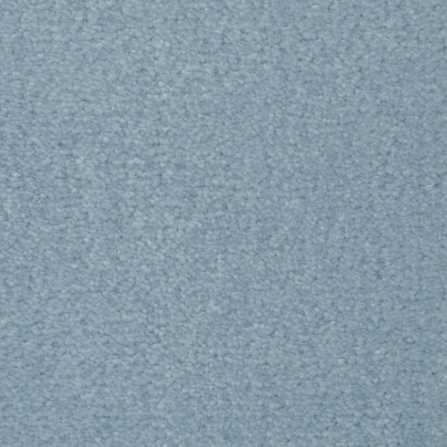 Close-up of Seduction On Trend Carpet in Summer Sky, featuring a light blue, textured looped pile. The soft, uniform surface showcases subtle shade variations, combining elegant style with durable flooring.