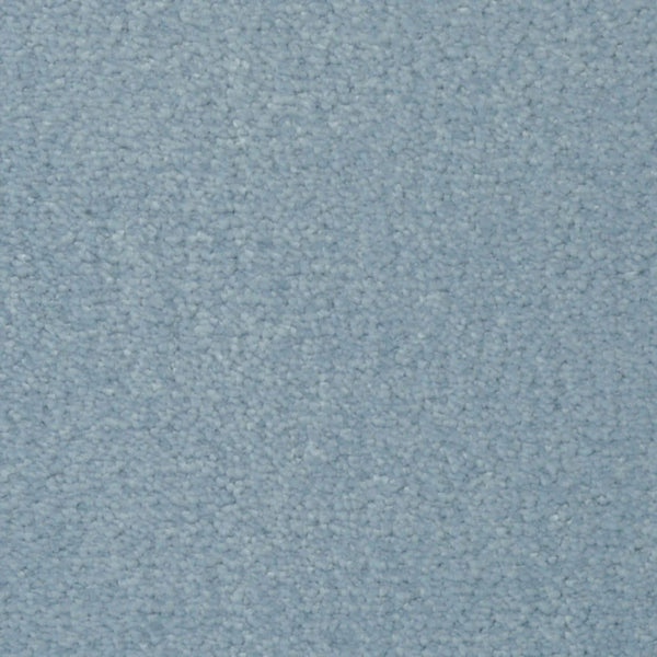 Close-up of Seduction On Trend Carpet in Summer Sky, featuring a light blue, textured looped pile. The soft, uniform surface showcases subtle shade variations, combining elegant style with durable flooring.