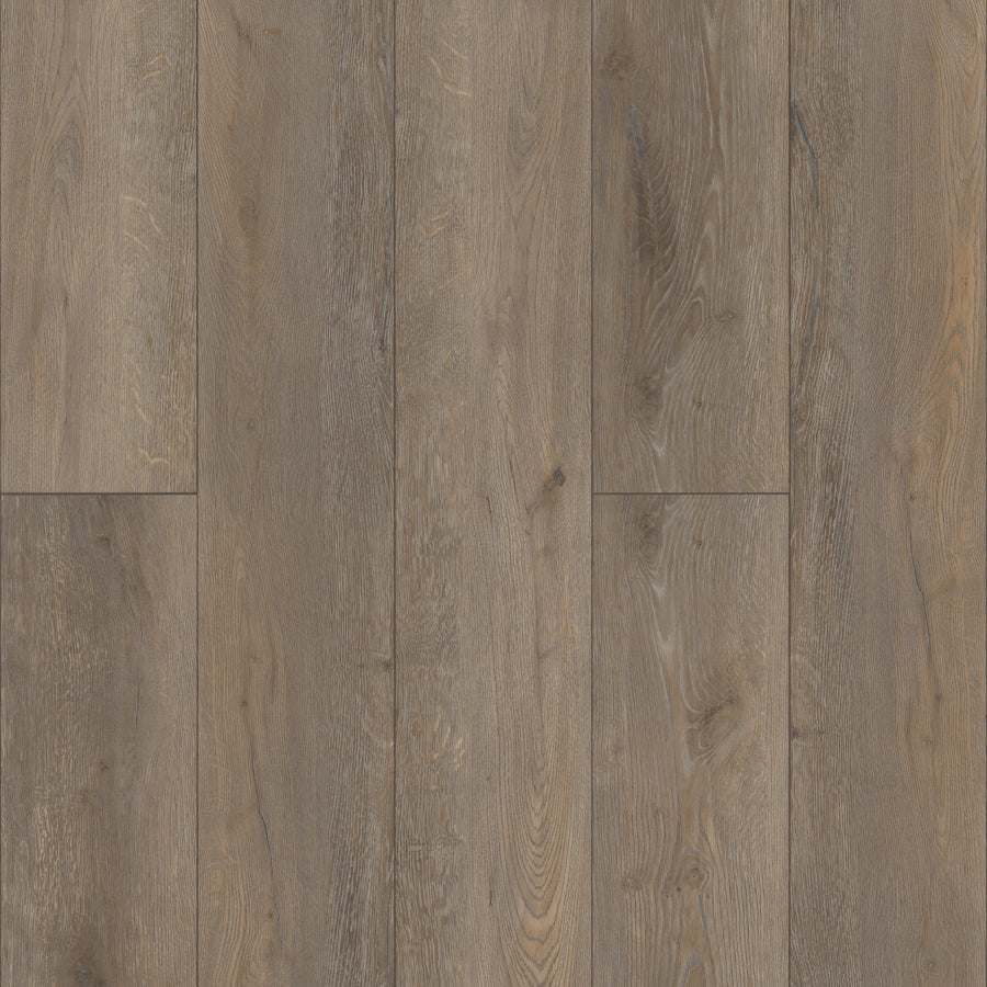 Close-up view of Coretec Pro Plus XL Enhanced Vinyl flooring with wide planks in natural light brown, featuring wood grain patterns and knots for a rustic look, plus the advantage of waterproof performance.