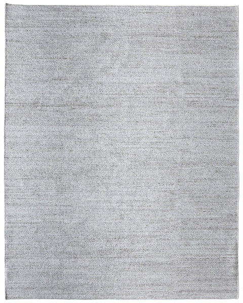 The Finley Area Rug is a large, rectangular light gray rug with a subtle mottled texture and no visible patterns—perfect for enhancing your home's décor.