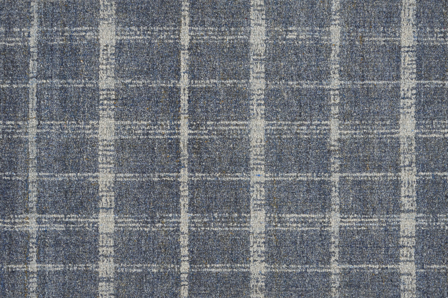 Tartan Tones On Trend Carpet in Denim color features a textured blue fabric with a classic white plaid pattern, inspired by luxurious Scottish Tartan designs.