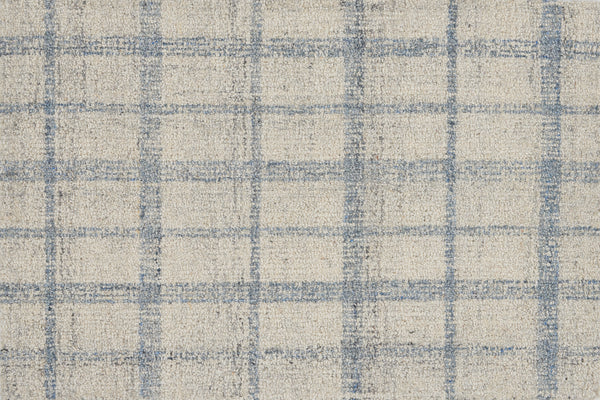 The Tartan Tones On Trend Carpet in Horizon features a grid of intersecting light blue lines on an off-white base, inspired by Scottish patterns. Slightly irregular lines create a textured, soft, and woven look.