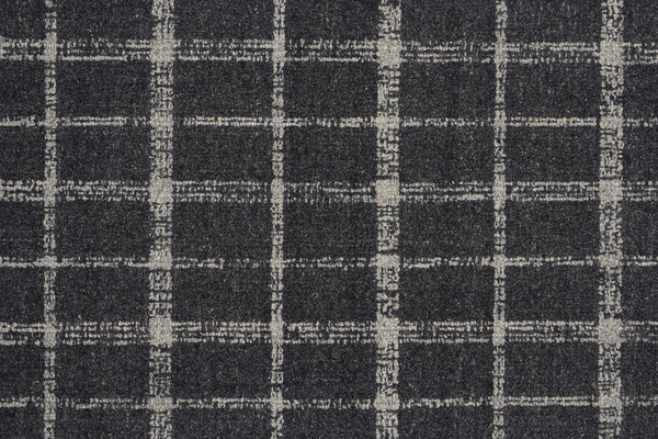 A close-up of the Tartan Tones On Trend Carpet in Mineral showcases a dark gray textured surface with a hand-drawn look, featuring light gray uneven grid lines inspired by classic Scottish plaid.