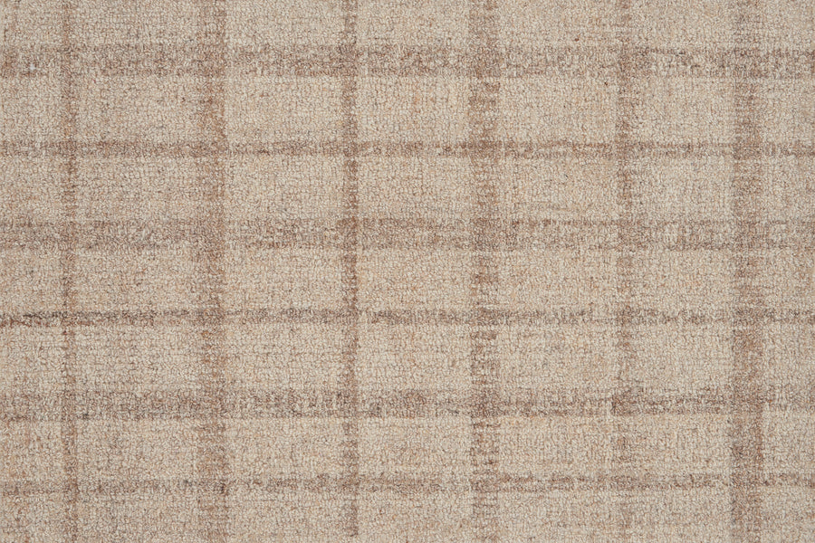 Close-up of the Tartan Tones On Trend Carpet in Oatmeal, showcasing a beige and light brown plaid with intersecting lines reminiscent of classic Scottish tartan patterns.