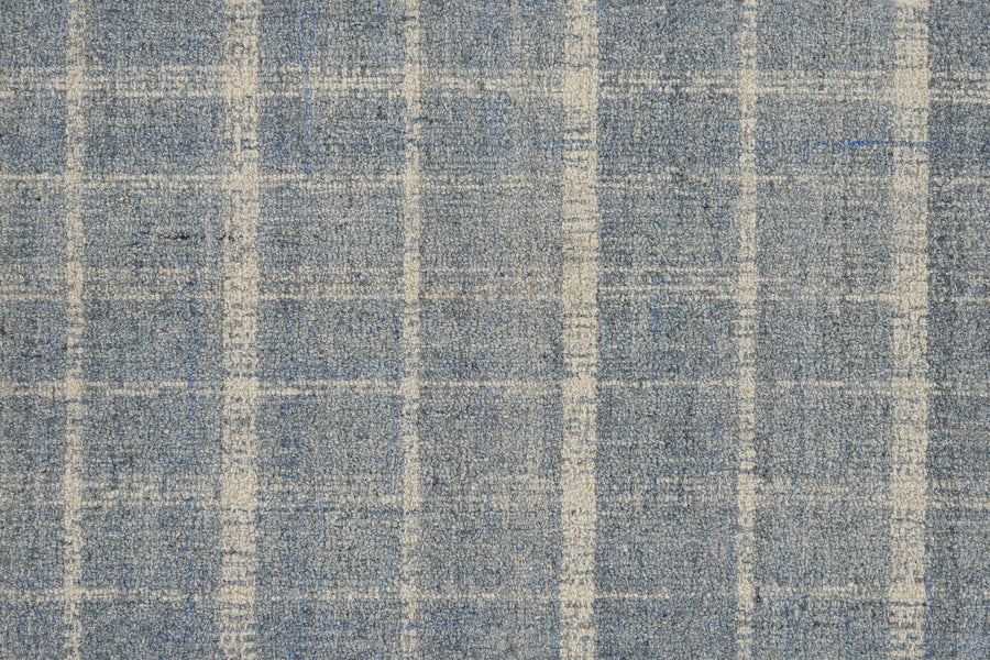Close-up of the Tartan Tones On Trend Carpet in Sky, featuring a blue and white checkered pattern inspired by traditional Scottish designs, showcasing its textured fibers and intersecting lines.