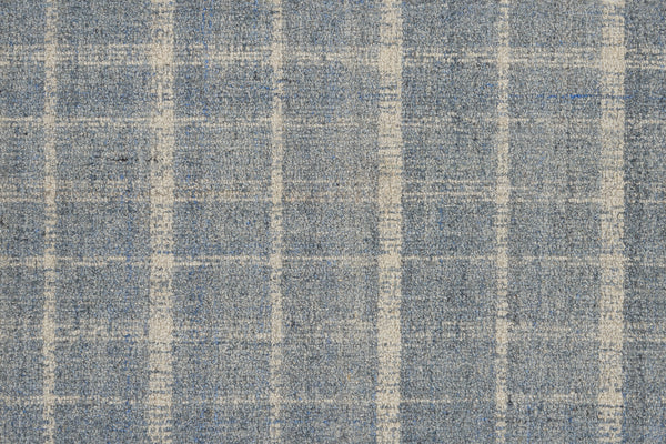 Close-up of the Tartan Tones On Trend Carpet in Sky, featuring a blue and white checkered pattern inspired by traditional Scottish designs, showcasing its textured fibers and intersecting lines.