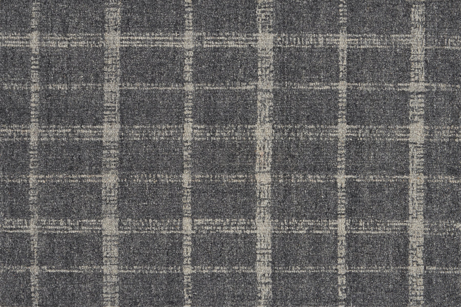 Tartan Tones On Trend Carpet in Smoke features a textured fabric with a dark gray base and off-white, uneven grid lines. The rough pattern gives it a casual, woven look inspired by classic Scottish tartan designs.