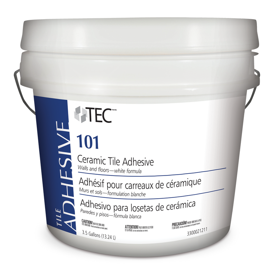 A white 3.5-gallon bucket of TEC Tile Adhesive TA101 with blue and gray labeling in English, French, and Spanish, featuring a sturdy metal handle.