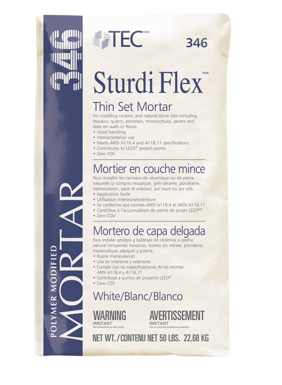 TEC Sturdi Flex is a polymer-modified thin set mortar available in a 50 lb (22.68 kg) bag. The mostly white packaging with blue text includes instructions and warnings in English, French, and Spanish. This zero VOC product is safe for indoor use.