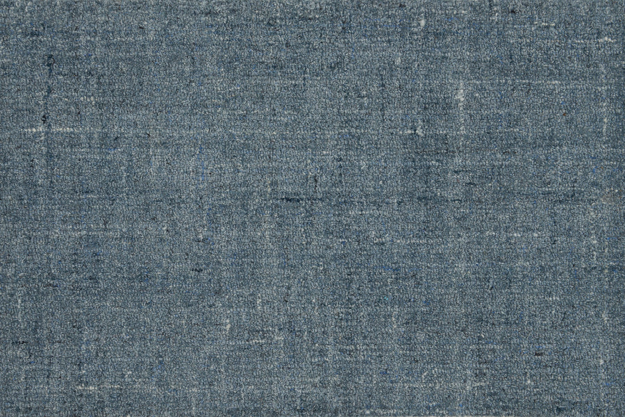 Close-up of Terrain On Trend Carpet in Lakeside, showcasing woven blue-gray fibers with subtle variations—evoking a rustic, slightly worn look ideal for contemporary spaces or as inspiration for durable commercial flooring.