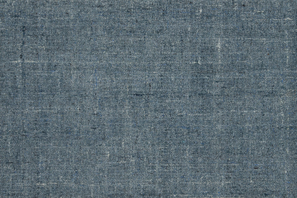 Close-up of Terrain On Trend Carpet in Lakeside, showcasing woven blue-gray fibers with subtle variations—evoking a rustic, slightly worn look ideal for contemporary spaces or as inspiration for durable commercial flooring.