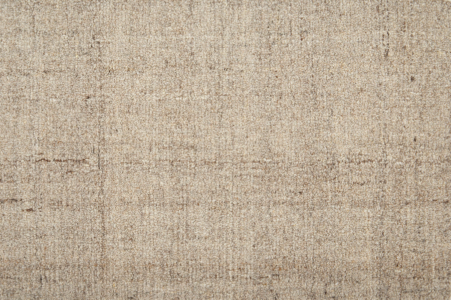 Close-up of Terrain On Trend Carpet in Prairie—a textured beige and light brown floor with a subtle grid pattern. Its mixed fibers and color variations create a soft, neutral look, ideal for contemporary spaces needing durable flooring.