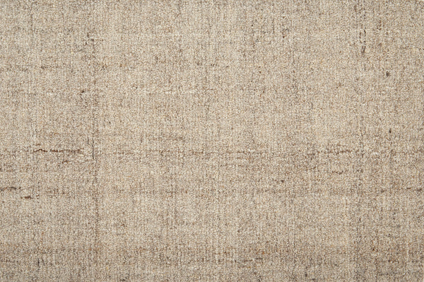 Close-up of Terrain On Trend Carpet in Prairie—a textured beige and light brown floor with a subtle grid pattern. Its mixed fibers and color variations create a soft, neutral look, ideal for contemporary spaces needing durable flooring.