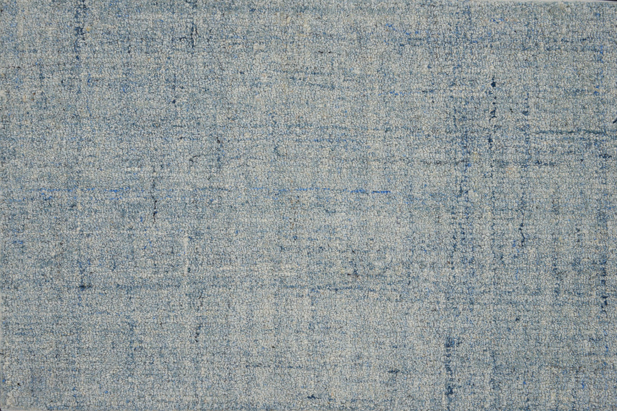 A close-up of the Terrain On Trend Carpet in Rapids—a soft, woven look with subtle light blue and gray tones—offers contemporary spaces a stylish, textured, and durable flooring option.