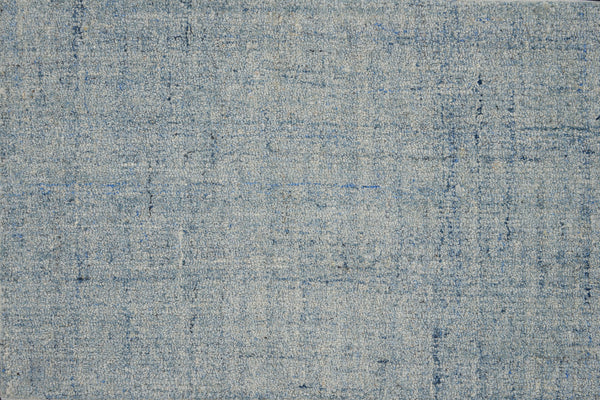 A close-up of the Terrain On Trend Carpet in Rapids—a soft, woven look with subtle light blue and gray tones—offers contemporary spaces a stylish, textured, and durable flooring option.