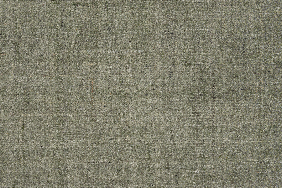 Close-up of Terrain On Trend Carpet in Sagebrush, featuring a textured grey surface with a subtle woven pattern and color variations—ideal as a soft, neutral background for contemporary or commercial flooring.