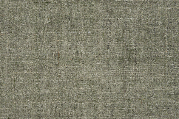 Close-up of Terrain On Trend Carpet in Sagebrush, featuring a textured grey surface with a subtle woven pattern and color variations—ideal as a soft, neutral background for contemporary or commercial flooring.