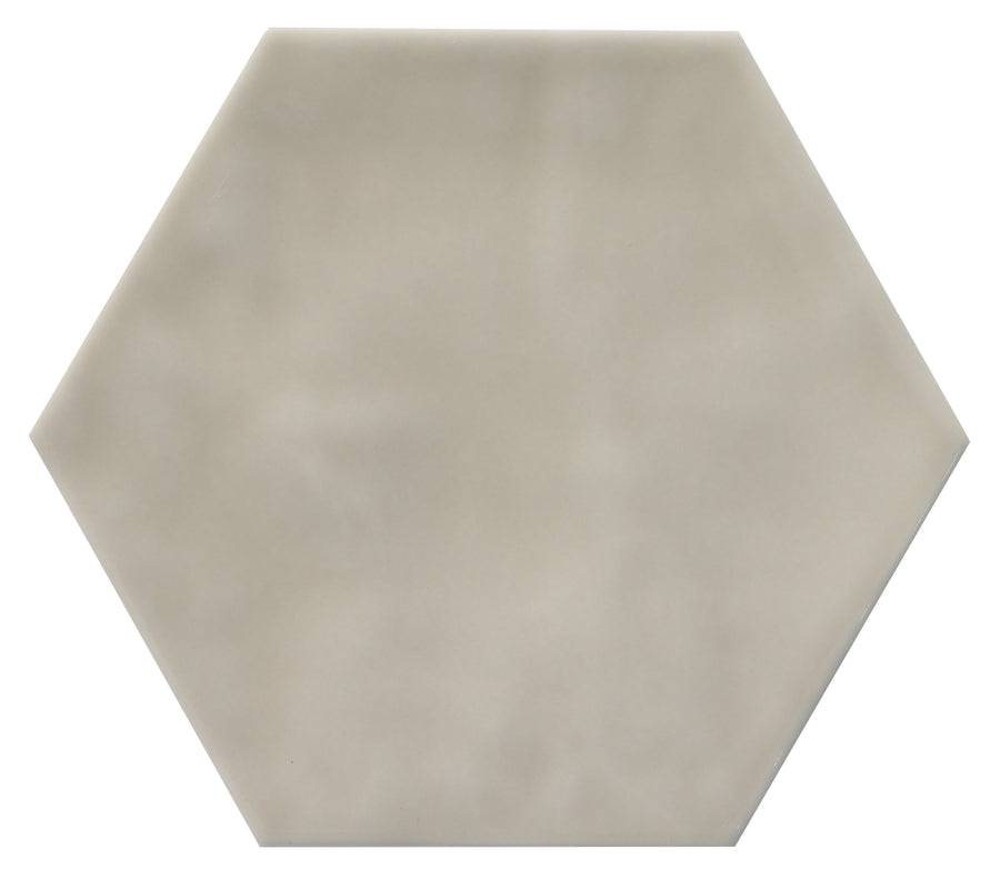 The Zephyr 4.2x4.9 Hexagon Ceramic Tile features a light gray, matte finish with subtle cloudy patterns; shown against a white background and available as a special-order item.