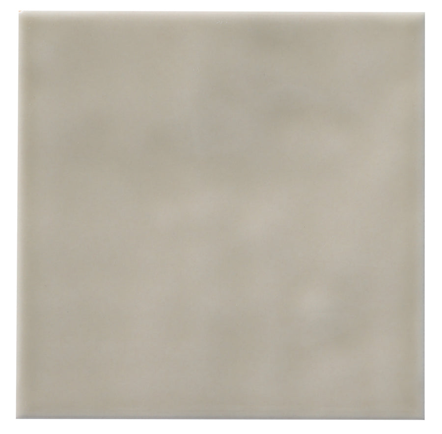 The Zephyr 4x4 Ceramic Tile features a plain, square Mediterranean design in light beige with a smooth, slightly glossy finish.