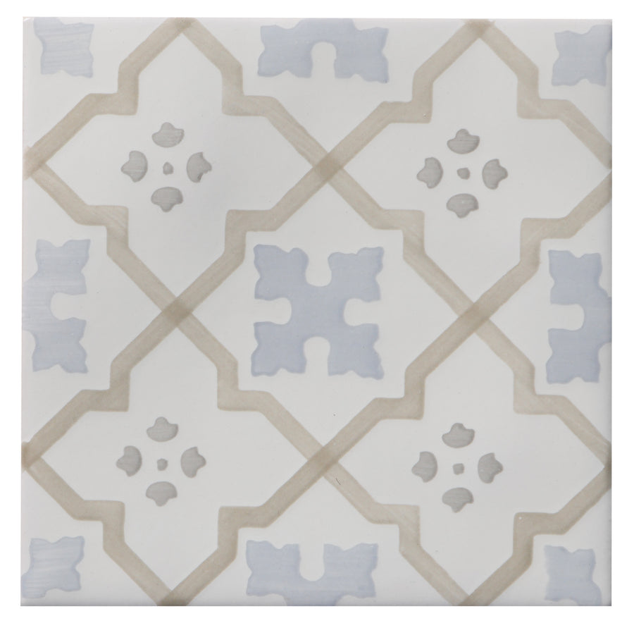 The Zephyr 4x4 Talisman Deco Ceramic Tile is a square ceramic tile with beige diamond outlines and light blue-gray geometric shapes on white, creating a subtle vintage Mediterranean look reminiscent of handcrafted luxury.