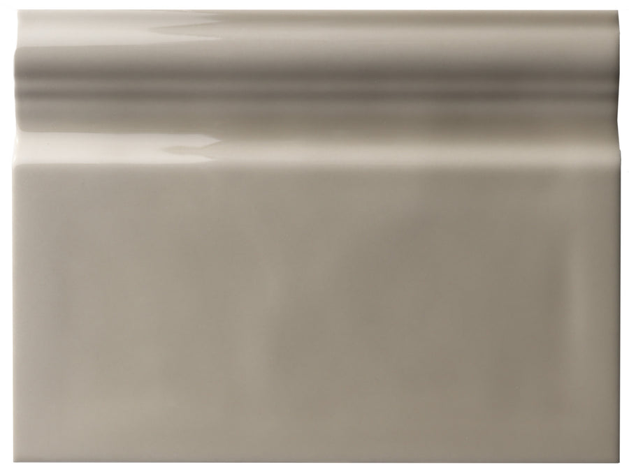 The Zephyr 6x8 Ceramic Baseboard features a glossy, light gray surface with a raised, rounded top edge, offering handcrafted luxury ideal for Mediterranean baseboard designs or special-order installations.
