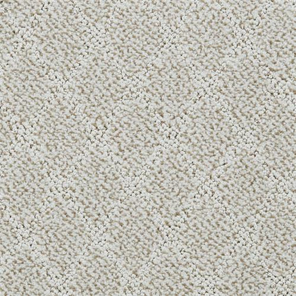 Close-up of Fine Art On Trend Carpet in Tarnished—its textured, light beige surface features a subtle diamond pattern and plush, soft fibers for a cozy yet contemporary elegance in any room.