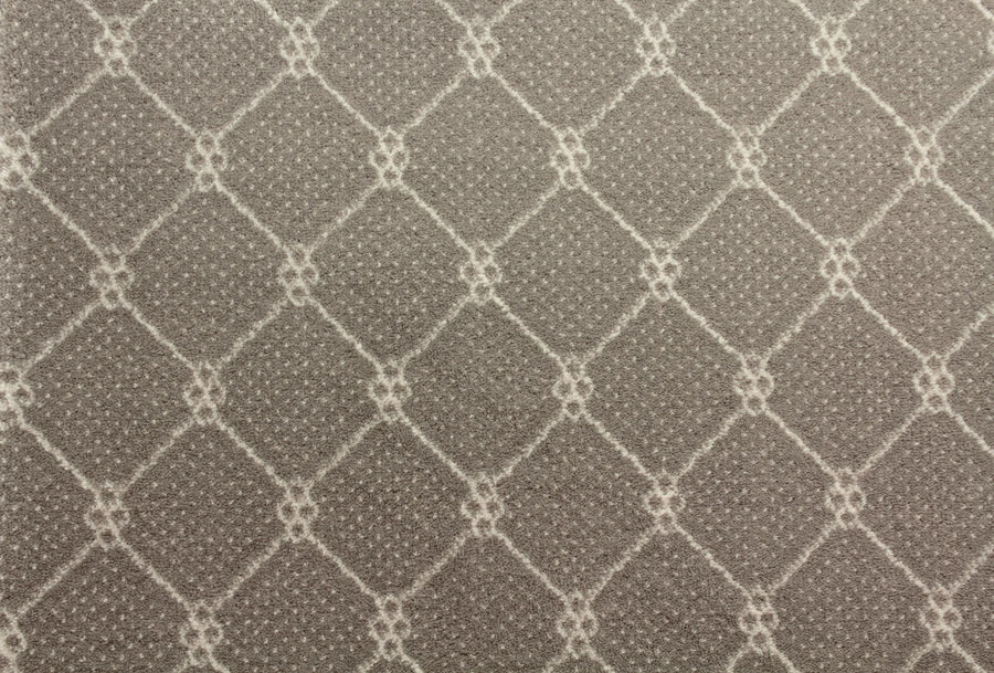 Close-up of Lake Boden Berber Carpet in taupe, showcasing a geometric diamond lattice with small dotted accents on a textured surface—ideal for durable, modern home flooring.