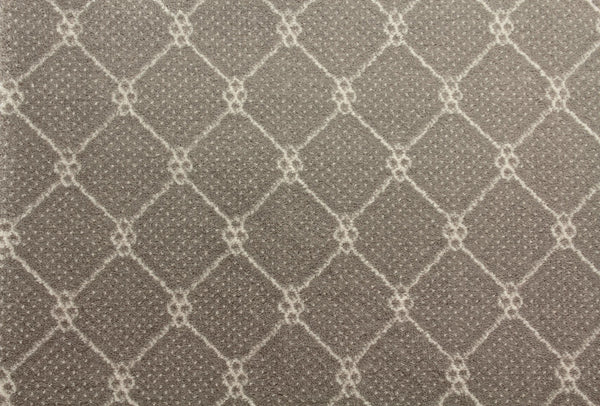 Close-up of Lake Boden Berber Carpet in taupe, showcasing a geometric diamond lattice with small dotted accents on a textured surface—ideal for durable, modern home flooring.
