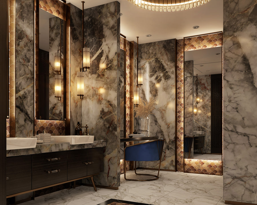 Luxurious bathroom with marble walls and floors, large mirrors, double sinks with dark wood cabinets, warm lighting from modern wall sconces, and a decorative chair by a vanity with elegant accents.