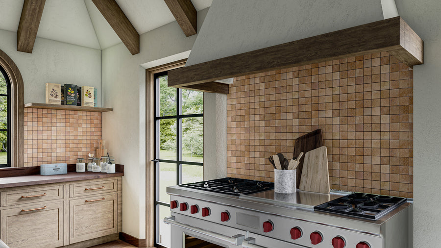 A modern kitchen with wooden beams, a large stove with red knobs, tan tile backsplash, wooden cabinets, utensils in a holder, cutting boards, and a shelf with jars and boxes. Large windows let in natural light.