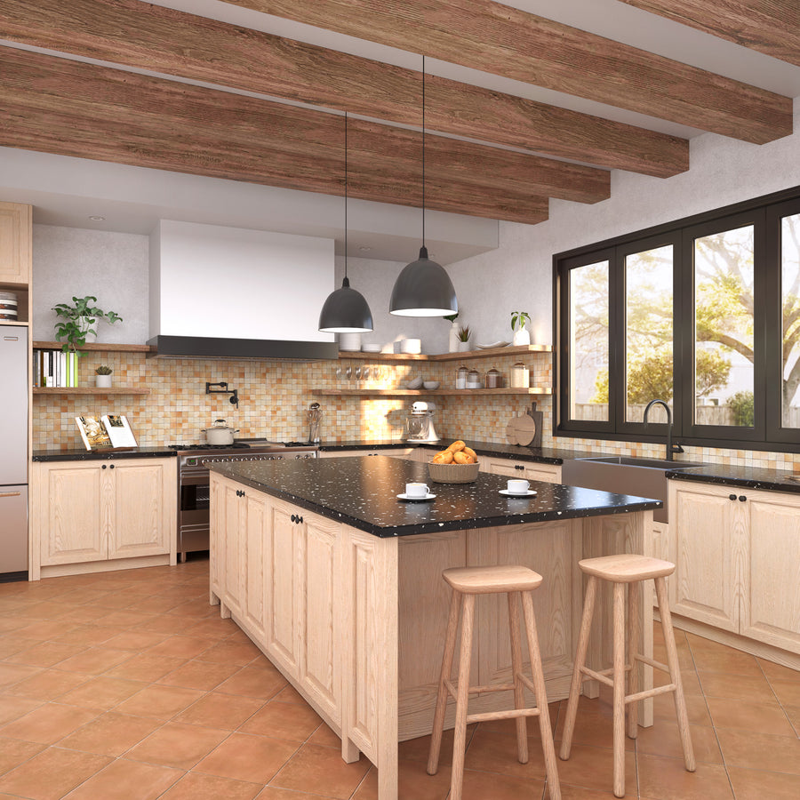 Modern kitchen with light wood cabinetry, a large black island countertop, two wooden stools, pendant lights, and large windows letting in natural light. There are shelves, a stove, and a tiled backsplash.
