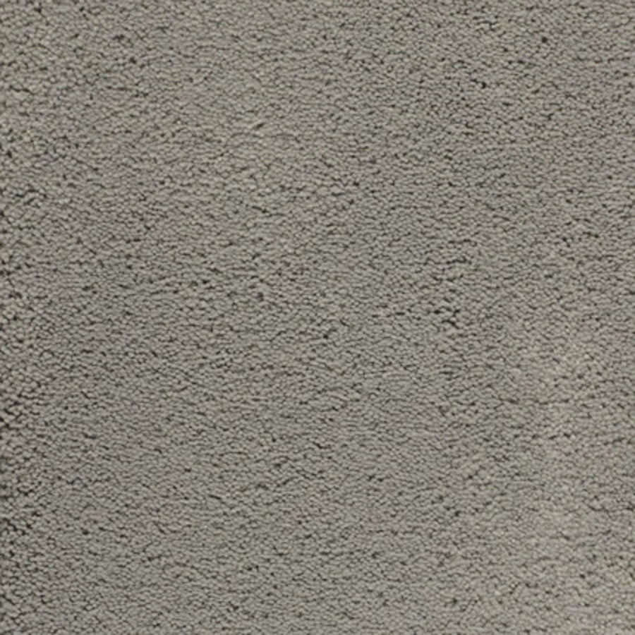 Close-up of Dolce Family Friendly Carpet in Thundercloud, featuring a textured, gray surface with subtle variations—reminiscent of durable finishes for high-traffic, modern interiors.