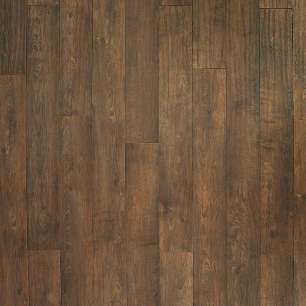 A close-up of Western Row 6 1/8' Waterproof Laminate in Tilled Oak highlights the rich wood grain, color variations, and textured detail for a premium flooring look.