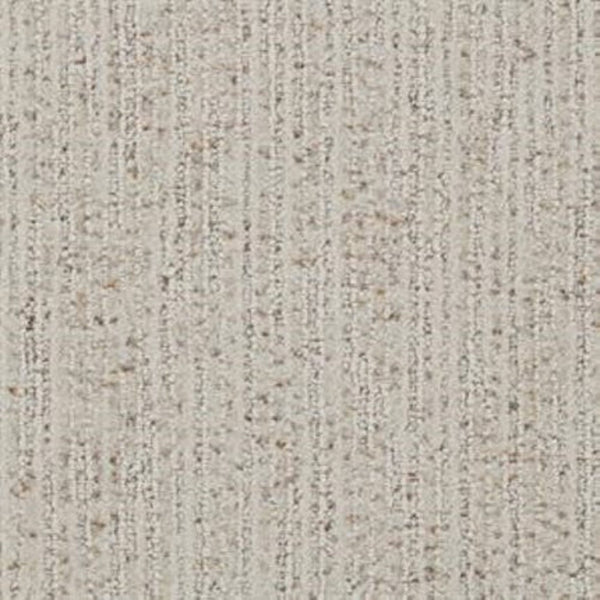 Close-up of the Suspicion Family Friendly Carpet in Tinge, showing a durable light beige surface with subtle vertical lines and darker fiber specks throughout.