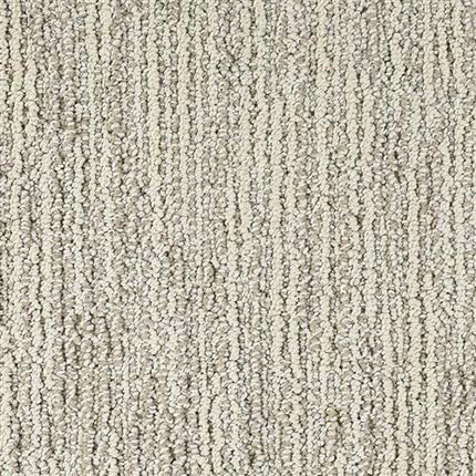 Close-up of Advocate Berber Carpet in Top Honor, showing its premium loop pile with vertical rows of tightly woven fibers in light tan and cream shades.