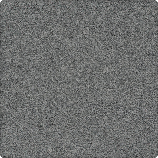 A close-up of the Traditional Cheer Pet Friendly Carpet in Lyric shows its gray, textured, stain-resistant surface with a soft, uniform look and rounded corners.