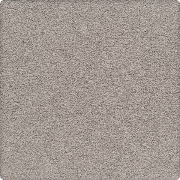 A close-up of the Traditional Cheer Pet Friendly Carpet in Planetary—a light gray, soft-textured, durable carpet with a uniform, plush surface and rounded corners—ideal for pet-friendly homes.