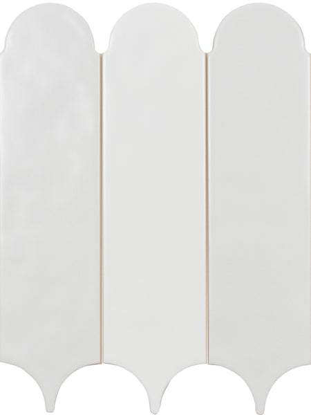 Three vertically aligned, white Tranquill 3x12 Glazed Ceramic Tiles, featuring scalloped tops and pointed arches at the bottom, create a timeless look in neutral hues reminiscent of classic ceramic tile design.
