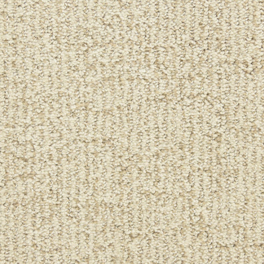 Close-up of the Victor Family Friendly Carpet in Treasure. This durable, beige carpet features a textured, looped pile with tightly woven fibers for a soft, uniform look—ideal for any home.