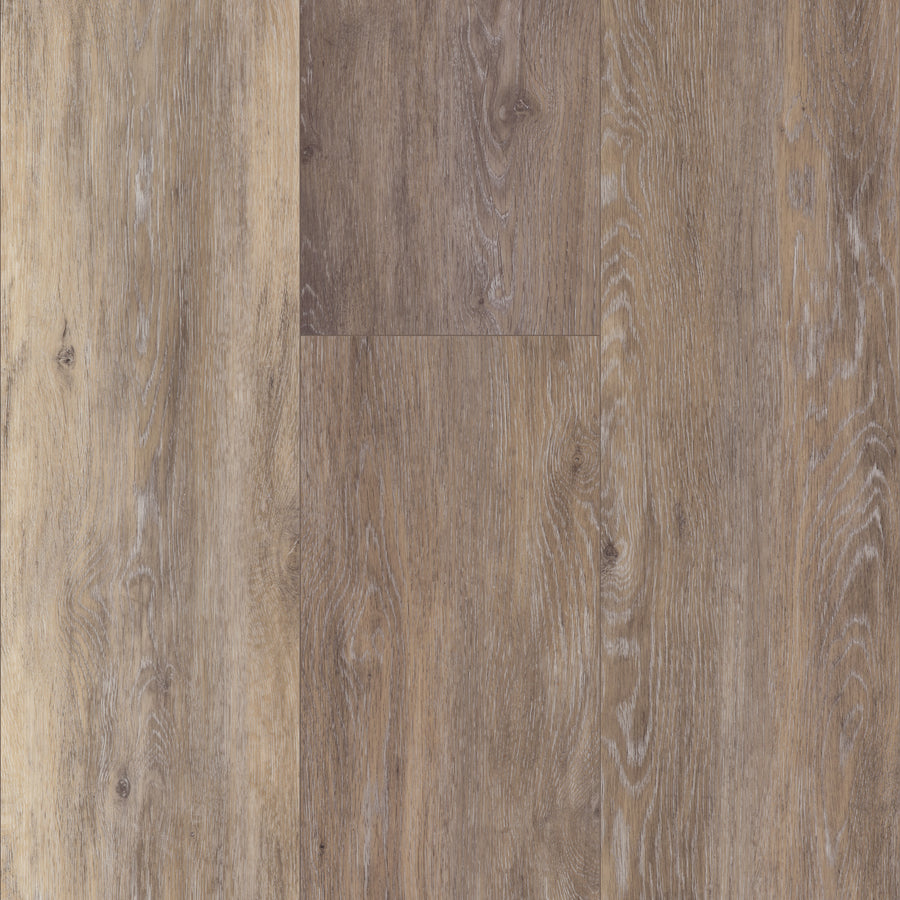 Close-up of Coretec Plus XL Enhanced Vinyl flooring in light to medium brown, highlighting natural wood grain, subtle color variation, and waterproof durability.