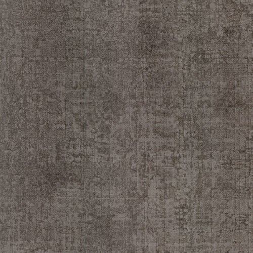 A close-up of Ithaca On Trend Carpet in Ulysses shows a textured, dark gray, slightly mottled surface with a weathered look, engineered for high-traffic areas and stain resistance.