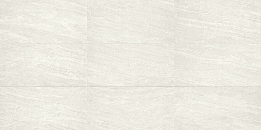 Cosmic 12x24 Rectified Porcelain Tile in light gray features subtle wavy and linear veining that mimics natural stone, offering a luxury look. The rectified edges allow for precise, seamless grid pattern installation.