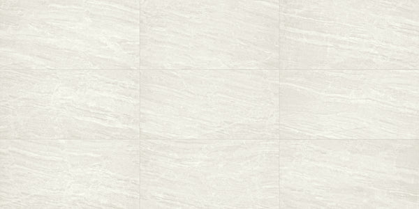 Cosmic 12x24 Rectified Porcelain Tile in light gray features subtle wavy and linear veining that mimics natural stone, offering a luxury look. The rectified edges allow for precise, seamless grid pattern installation.