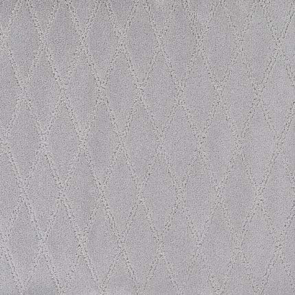 The Absolute Berber Carpet in Utter features a light gray textured surface with a subtle diamond-shaped stitched pattern, offering durability for high-traffic areas and a soft, quilted look.